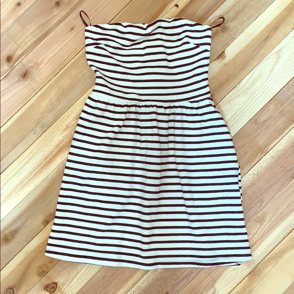 White and black strapless dress.